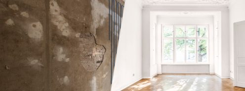empty room in old apartment building with wooden parquet floor - real estate interior