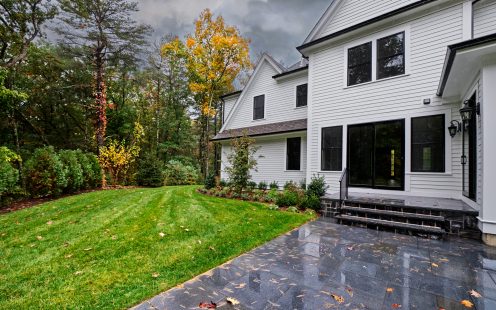 Autumn colors fade as a rainy breezy day soaks the back patio and garden